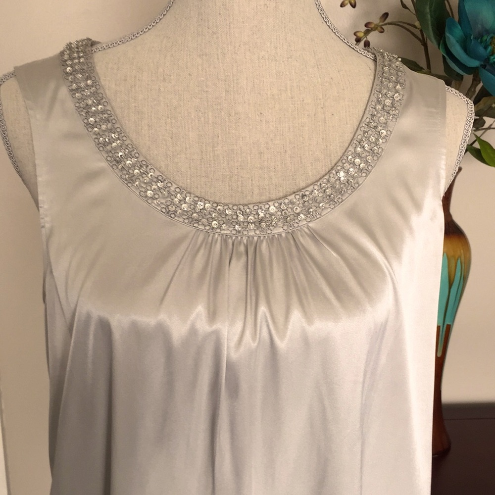 Silver sleeveless top with neckline beading